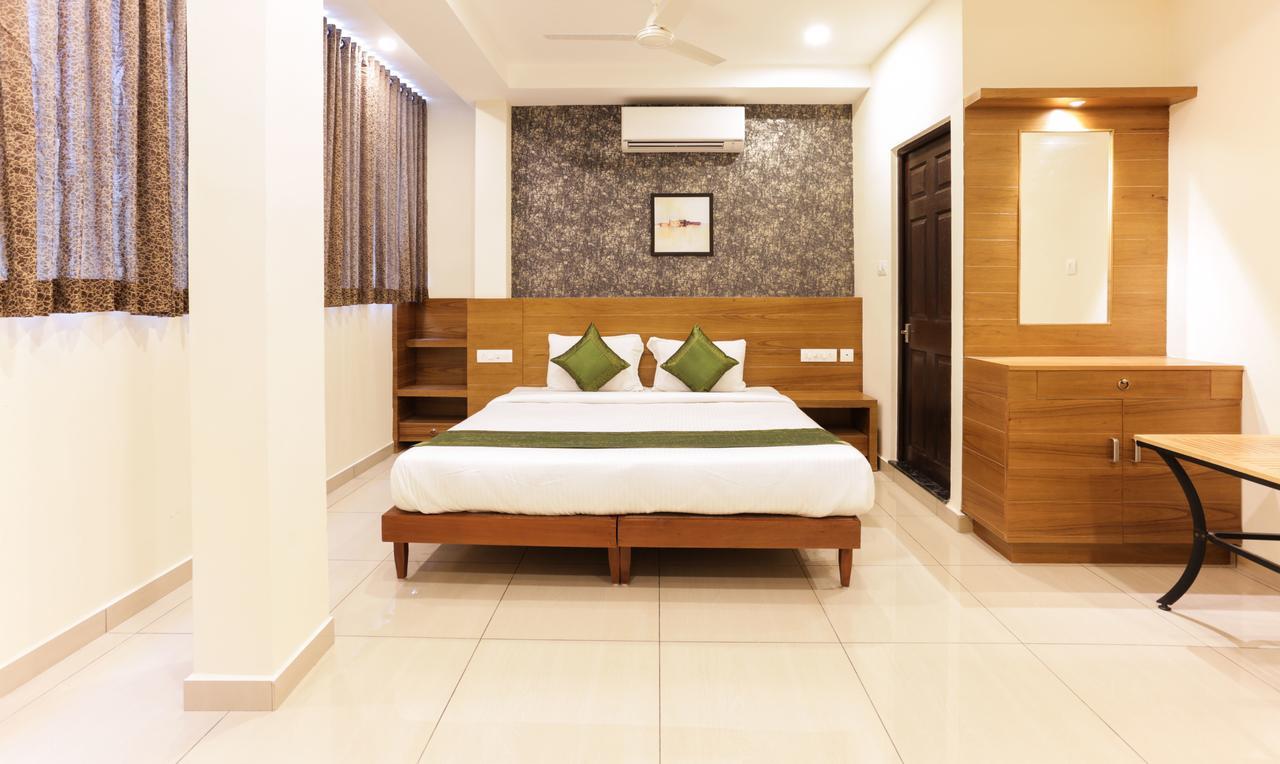 Treebo Trend Cmks Gulmohar Suites Коччи Экстерьер фото